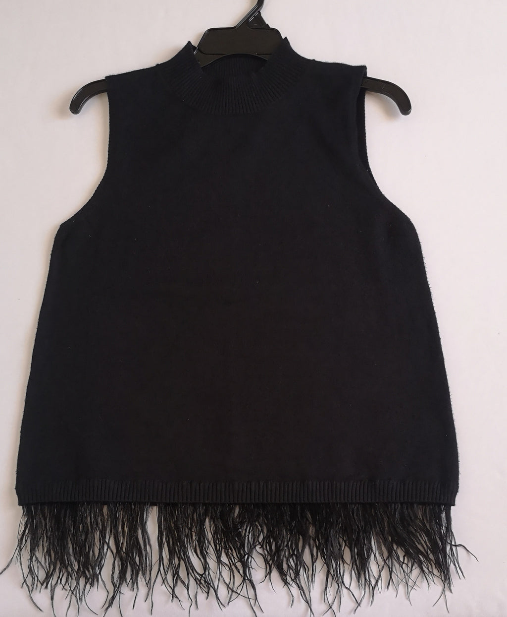 Blusa con plumas abajo incluye collar